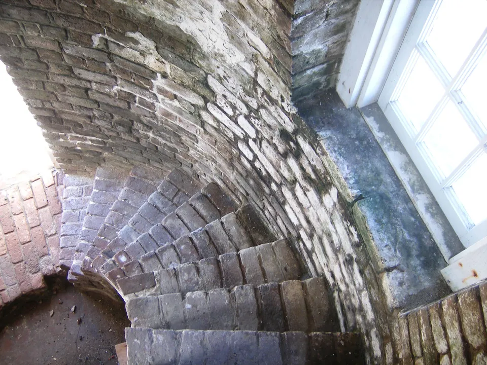 Curving brick steps inside the lighthouse