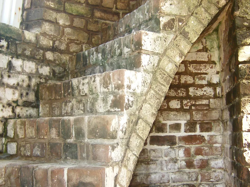 Close view of the lighthouse brick staircase and interior walls
